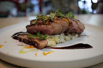 Low-temperature duck magret with mushroom risotto and orange zest - Image 1