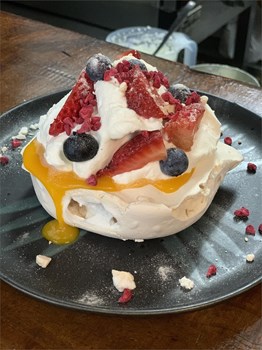  Pavlova with passion fruit sauce and wild fruits - Image 1